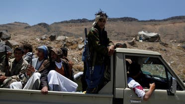 Houthi fighters ride on the back of a patrol truck as they secure a road, as protesters march, denouncing plans by the Arab coalition to attack Hodeidah, from Yemen's capital Sanaa to the port city of Hodeidah April 19, 2017. (Reuters)