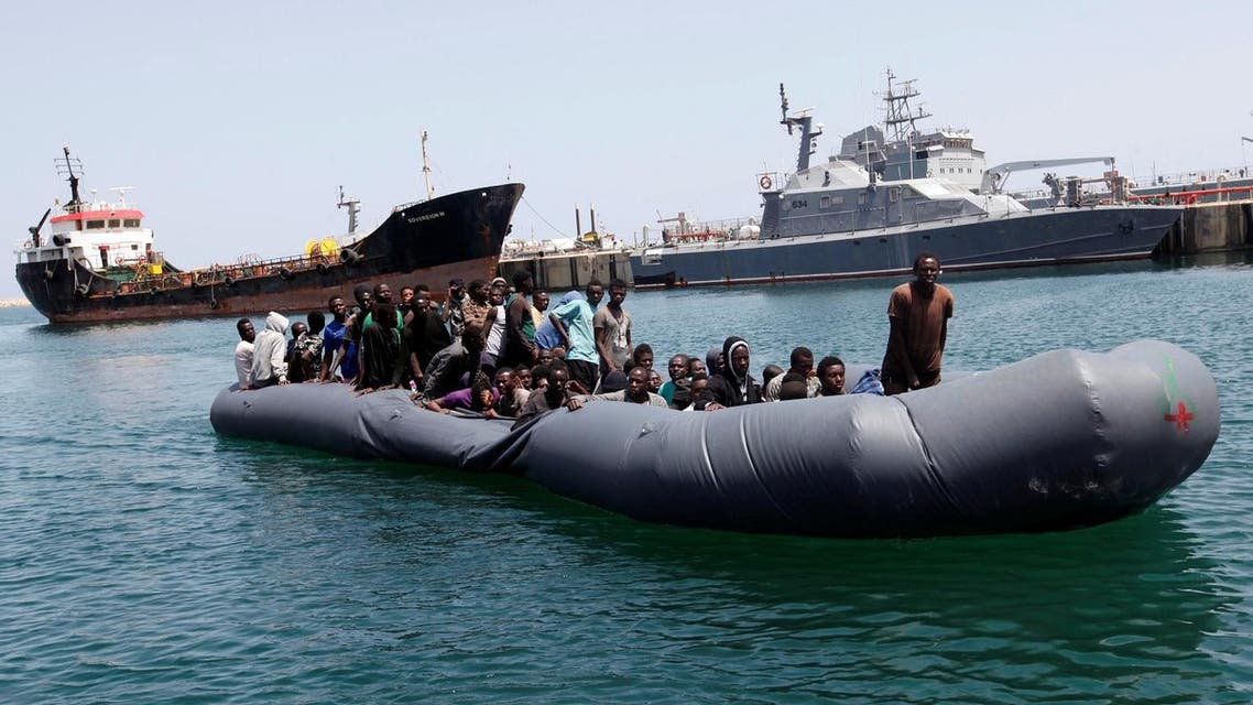Illegal migrants arrive in a dinghy at a naval base after they were rescued by Libyan coastguard in the coastal city of Tripoli, Libya, May 6, 2017. (Reuters)