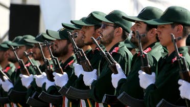 Iran's elite Revolutionary Guard troops attacks a naval vessel during a military drill in the Strait of Hormuz in southern Iran on February 25, 2015. (AFP)