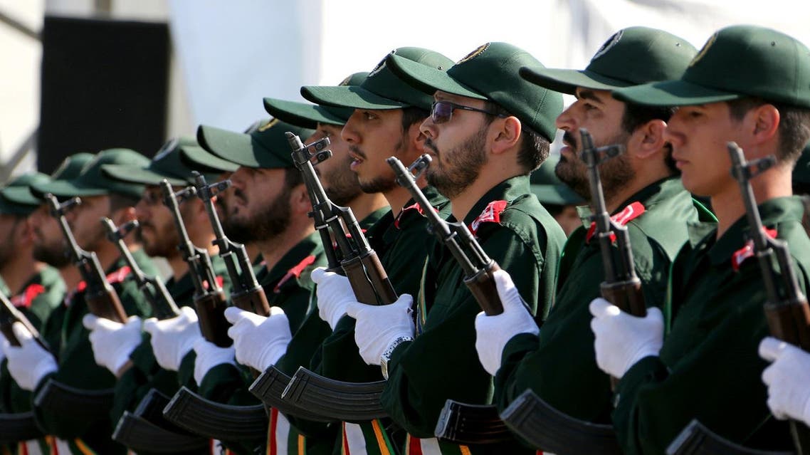 Iran's elite Revolutionary Guard troops attacks a naval vessel during a military drill in the Strait of Hormuz in southern Iran on February 25, 2015. (AFP)