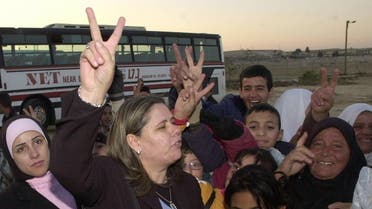 Palestinian jailed leader Marwan Barghuti's wife, Fadwa Barghouti flashes the "V" for victory sign outside the Israeli jail of Beersheva. (File Photo: AFP)