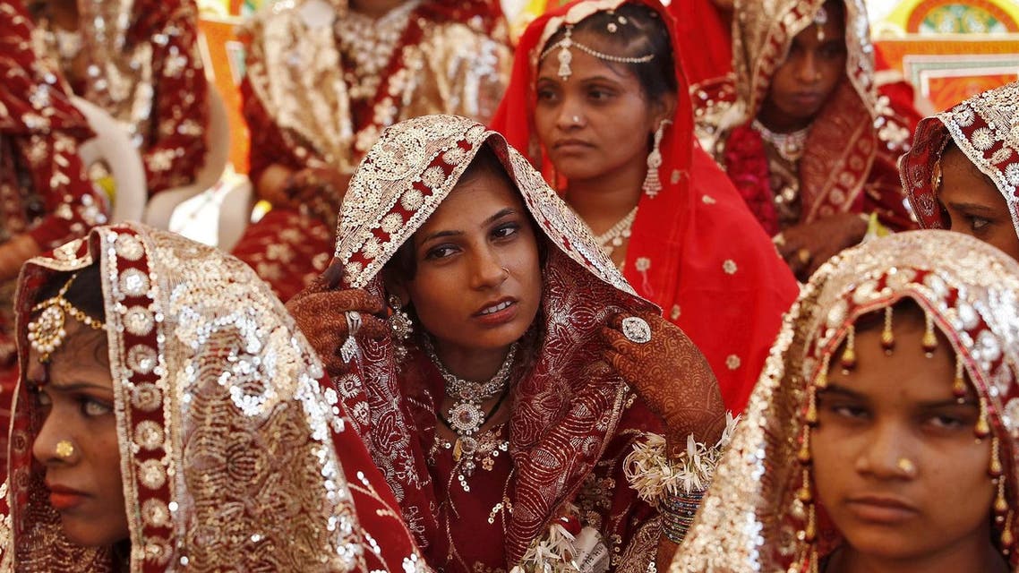 Muslim brides wait for the start of a mass marriage ceremony in Ahmedabad, India, October 11, 2015. A total of 65 Muslim couples from various parts of Ahmedabad. (Reuters)