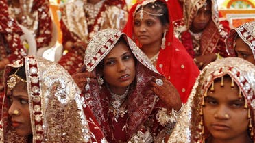 Muslim brides wait for the start of a mass marriage ceremony in Ahmedabad, India, October 11, 2015. A total of 65 Muslim couples from various parts of Ahmedabad. (Reuters)