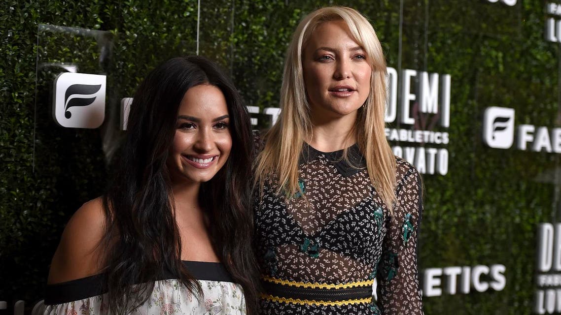 Demi Lovato and Kate Hudson arrive at the launch of Demi Lovato and Fabletics Collaboration Collection on Wednesday, May 10, 2017 in Beverly Hills. (AP)