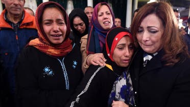Ouided Bouchamaoui consoles family members of the presidential guards who were killed in a bomb blast on a bus in central Tunis in the Tunisian capital on November 25, 2015. (AFP)