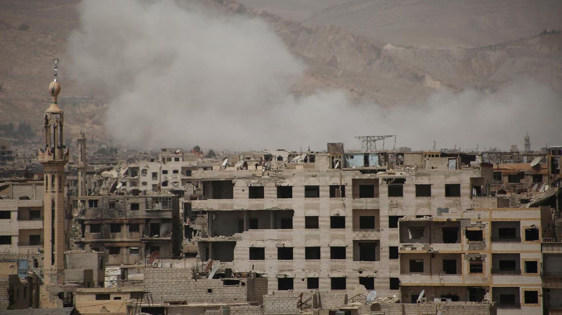A picture shows smoke billowing following reported air strikes on rebel positions in the opposition-controlled district of Qaboun on the outskirts of the Syrian capital Damascus in the Eastern Ghouta region on April 27, 2017. (AFP)