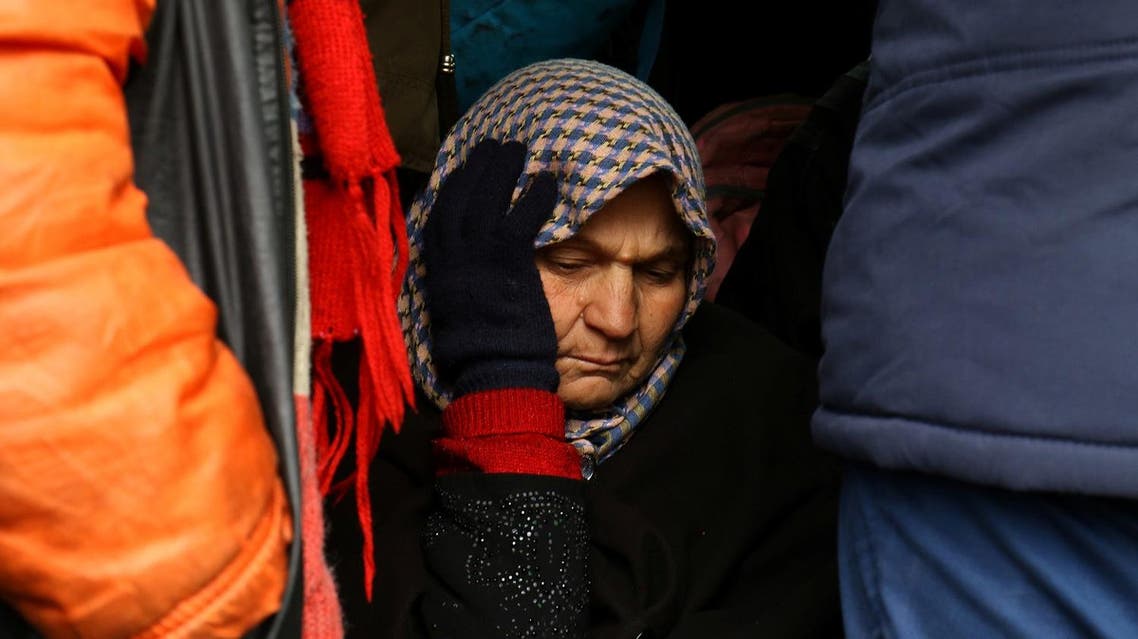 An evacuee from the Shi'ite Muslim villages of al-Foua and Kefraya rides a bus at insurgent-held al-Rashideen, Syria December 22, 2016. REUTERS/Ammar Abdullah