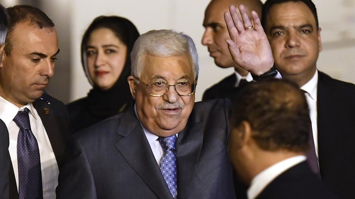 Palestine President Mahmoud Abbas (center) waves as he walks with officials after arriving at Palam Air Force Station in New Delhi on May 14, 2017. (AFP)