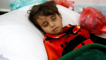 A girl infected with cholera lies on the ground at a hospital in Sanaa, on May 7, 2017. (Reuters)
