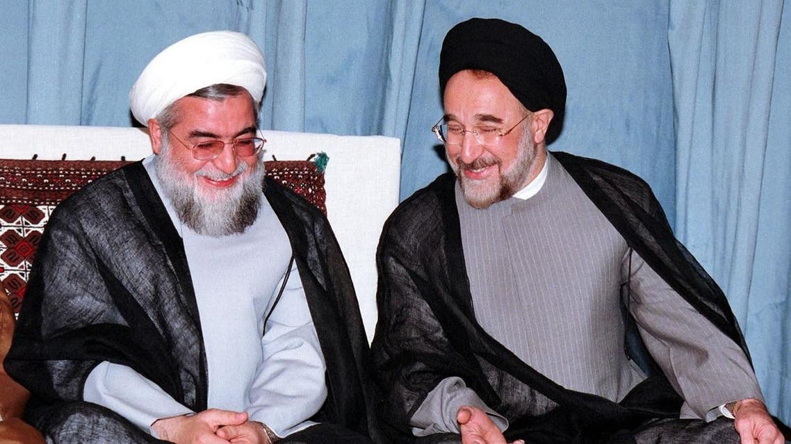 An old photo shows Iranian ex-president Khatami (R) sharing a laugh with Rouhani, who was a former deputy parliament speaker and member of Iran's Council of Experts at the time, in August, 2000 (AFP)