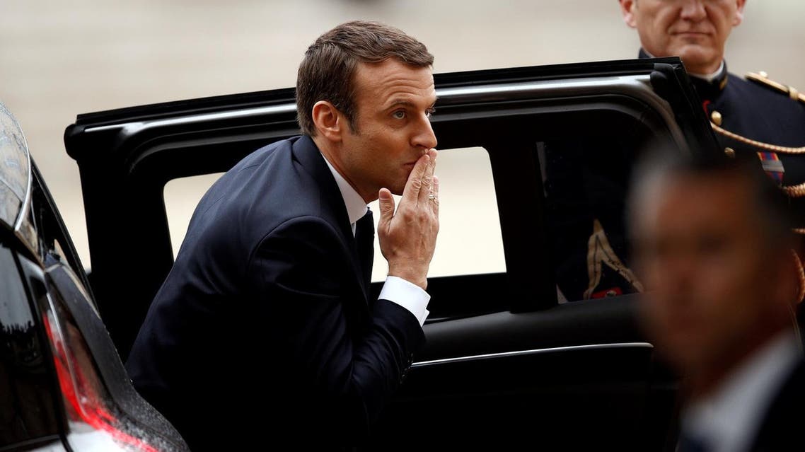 French President-elect Emmanuel Macron reacts as he arrives to attend a handover ceremony with outgoing President Francois Hollande at the Elysee Palace in Paris, France, May 14, 2017. REUTERS/Yoan Valat/Pool