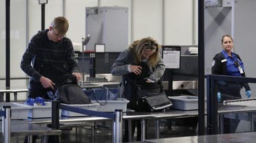 FORT LAUDERDALE, FL - MARCH 14: Travelers go through the TSA security checkpoint as Rep. Debbie Wasserman Schultz (D-FL) addressed the media about, 'President Trump's budget crisis', at the Fort Lauderdale-Hollywood International airport on March 14, 2017 in Fort Lauderdale, Florida. The congresswoman criticized the proposed cuts to the TSA, FEMA, and NOAA as well as the changes to the Affordable Care Act. Joe Raedle/Getty Images/AFP 