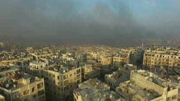 A still image from video taken December 12, 2016 of a general view of smoke rising over bomb damaged eastern Aleppo, Syria. Video released December 12, 2016. (Reuters)