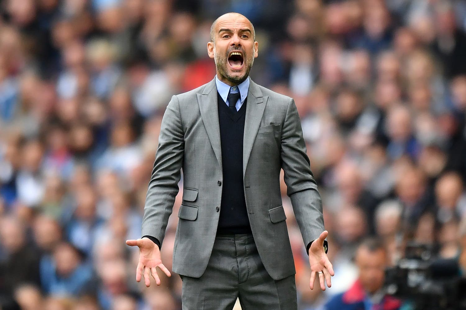 Manchester City's Spanish manager Pep Guardiola gestures on the touchline during the English Premier League football match between Manchester City and Leicester City at the Etihad Stadium in Manchester, north west England, on May 13, 2017. Manchester City won the game 2-1. (AFP)