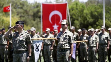 file photo from reuters: Turkish soldiers stand at attention during a ceremony for their comrade Mehmet Yalcin Nane who was killed by Islamic State militants on Thursday, at a military base in Gaziantep, Turkey, July 24, 2015. Turkish warplanes pounded Islamic State targets in Syria and police detained hundreds of suspected militants across Turkey on Friday, a sign that Ankara may have shed its hesitancy in taking a front-line role against jihadist fighters. Turkey has long been a reluctant partner in the U.S.-led coalition against Islamic State, emphasising the need to oust Syrian President Bashar al-Assad and saying Syrian Kurdish forces also pose a grave security threat 