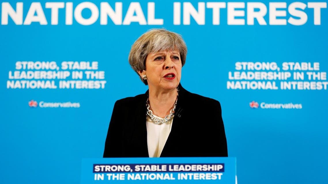 Britain's Prime Minister Theresa May answers a question during a news conference with Chancellor of the Exchequer Philip Hammond in London's Canary Wharf financial district. (Reuters)