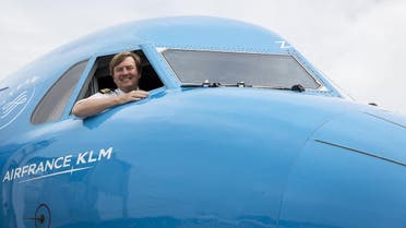 Dutch King Willem-Alexander looks out from the window of a KLM Cityhopper aircraft at Schiphol Airport, near Amsterdam. (KLM/AFP)