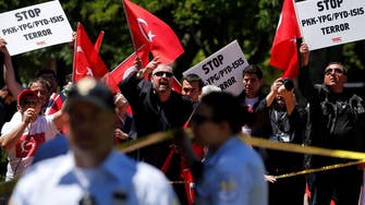 US capital slams “attack” as Erdogan guards clash with protest   