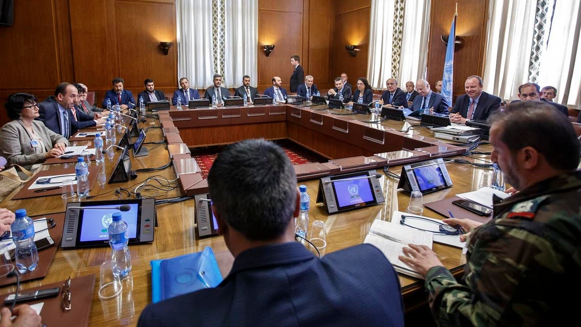 Syria's main opposition High Negotiations Committee (HNC) leader Nasr al-Hariri (2ndL) and UN Special Envoy of the Secretary-General for Syria Staffan de Mistura (3rdR) take part in a new round of Syria peace talks on May 16, 2017 at the United Nations Offices in Geneva. (AFP)