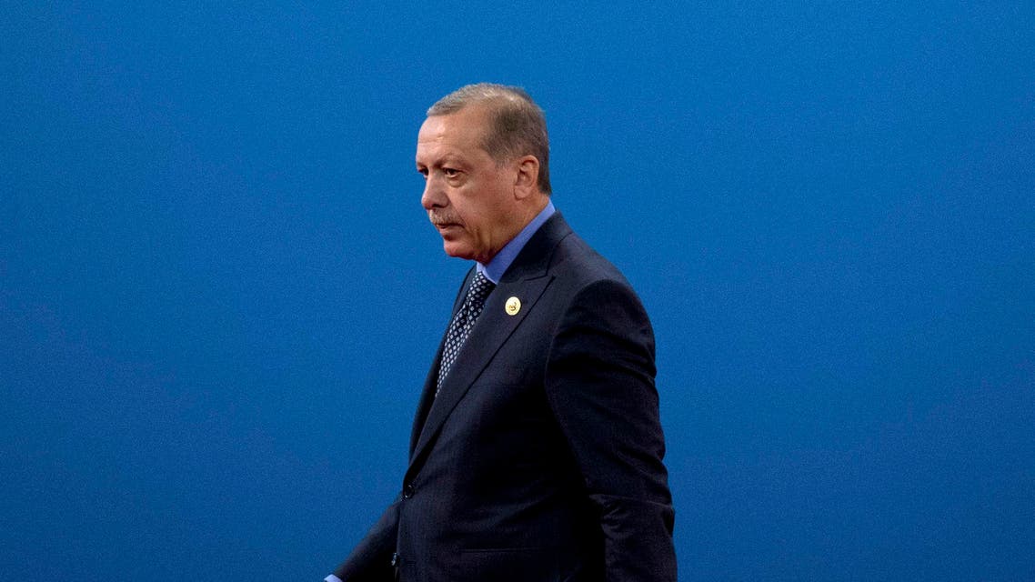 Turkey's President Recep Tayyip Erdogan leaves the stage after speaking during the opening ceremony of the Belt and Road Forum at the China National Convention Center (CNCC) in Beijing, Sunday, May 14, 2017. (AP)
