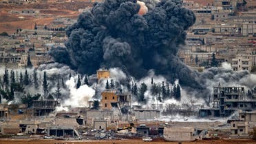 Smoke rises from the Syrian city of Kobani, following an airstrike by the US led coalition, seen from a hilltop outside Suruc, on the Turkey-Syria border Monday, Nov. 17, 2014. (AP)