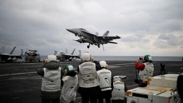 A US F18 fighter jet lands on the deck of US aircraft carrier. (Reuters)