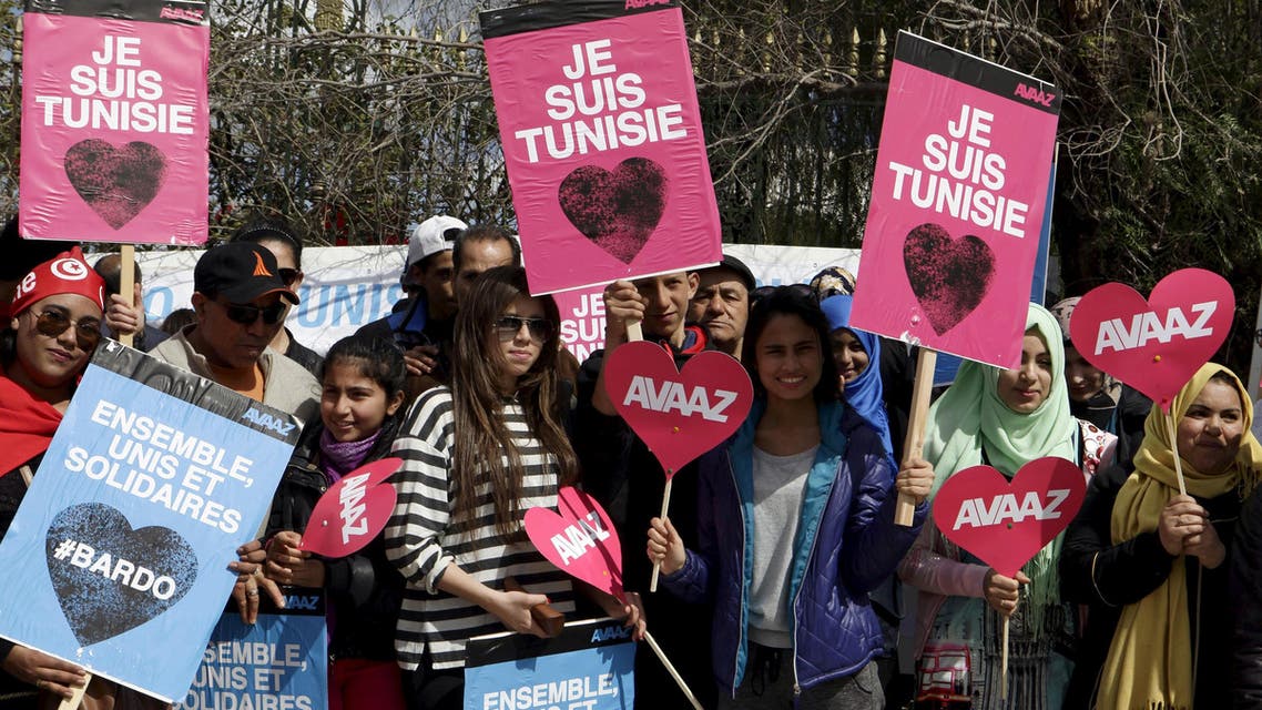 Tunisians hold posters that read "I am Tunisia" during a march against extremism outside the Bardo Museum in Tunis March 29, 2015. reuters