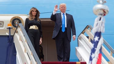 US President Donald Trump and first lady Melania Trump wave as they arrive in Riyadh, Saudi Arabia, on May 20, 2017. (Reuters)