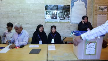 Iranian employees prepare a ballot box during the presidential election in Tehran, Iran, May 19, 2017. 