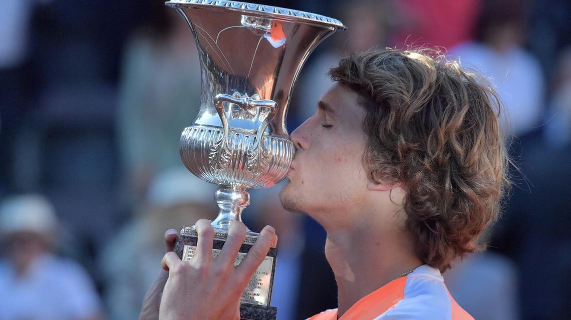 Alexander Zverev of Germany kisses the trophy after winning the ATP Tennis Open final against Novak Djokovic of Serbia on May 21, 2017, at the Foro Italico in Rome. (AFP)