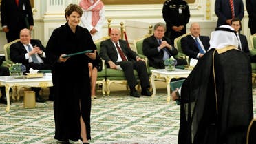 Lockheed Martin Chairman and CEO Marillyn Hewson (L) exchanges agreements with a Saudi official after a signing ceremony between Saudi Arabia's King Salman bin Abdulaziz Al Saud and U.S. President Donald Trump at the Royal Court in Riyadh. (Reuters)