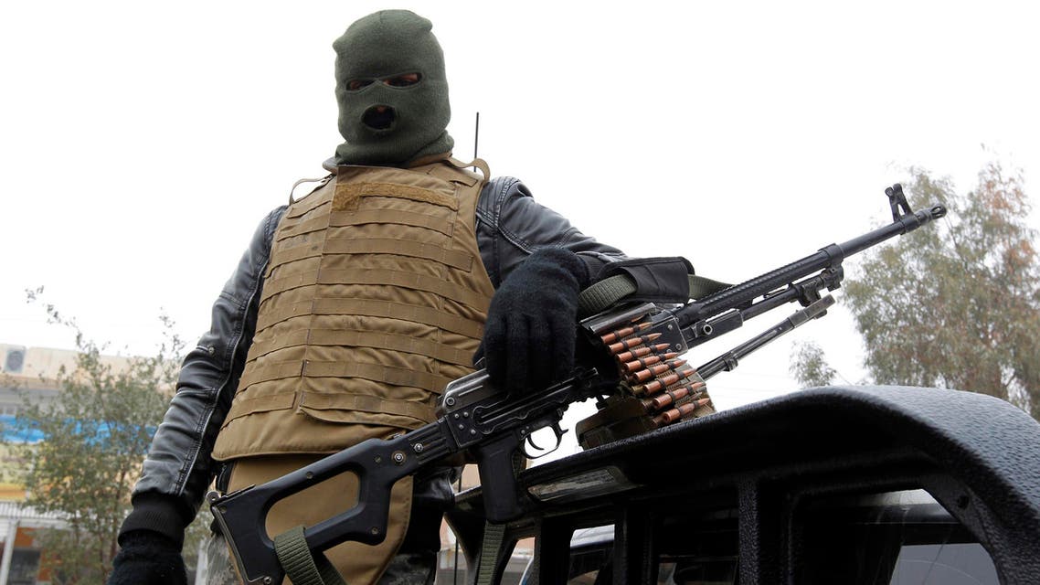 A member of the Iraqi pro-government forces stands guard in the city of Fallujah, that was recaptured from the Islamic State (IS) group nearly six months ago, in Iraq's western Anbar province on December 29, 2016.