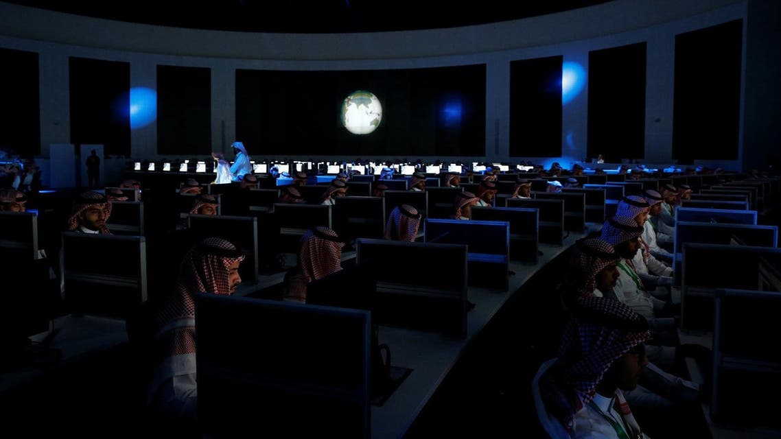 Data collectors sit at screens in new the Global Center for Combatting Extremist Ideology as they wait for a tour by U.S. President Donald Trump and Saudi Arabia's King Salman bin Abdulaziz Al Saud to commence in Riyadh, Saudi Arabia May 21, 2017. REUTERS/Jonathan Ernst