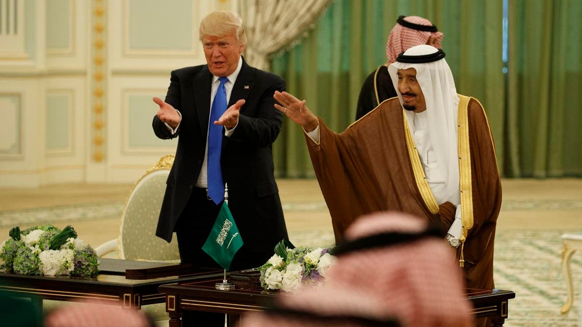 President Donald Trump and Saudi King Salam wave to the crowd during a signing ceremony at the Royal Court Palace, Saturday, May 20, 2017, in Riyadh. (AP)
