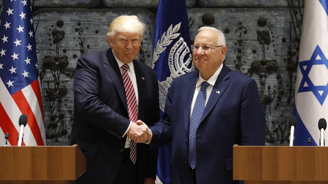 US President Donald Trump (L) shakes hands with Israeli President Reuven Rivlin after signing the guest book at the President's Residence in Jerusalem on May 22, 2017. AFP 