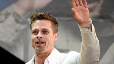 US actor Brad Pitt waves to his fans during the Japan premiere of his latest movie "War Machine" in Tokyo on May 23, 2017. The film will be released by online streaming on May 26. (AFP)
