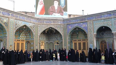Iranian women prepare to cast their votes for municipal and presidential elections in the city of Qom, 130kms south of Tehran, on May 19, 2017. (AFP)