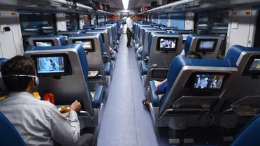 In this photograph taken on May 22, 2017, Indian passengers travel onboard the Tejas Express luxury train during its first journey between Mumbai and Goa in Mumbai. (AFP)