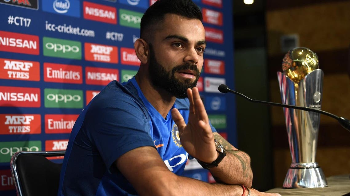 India’s Virat Kohli with the ICC Champions Trophy during the press conference in London. (Reuters)