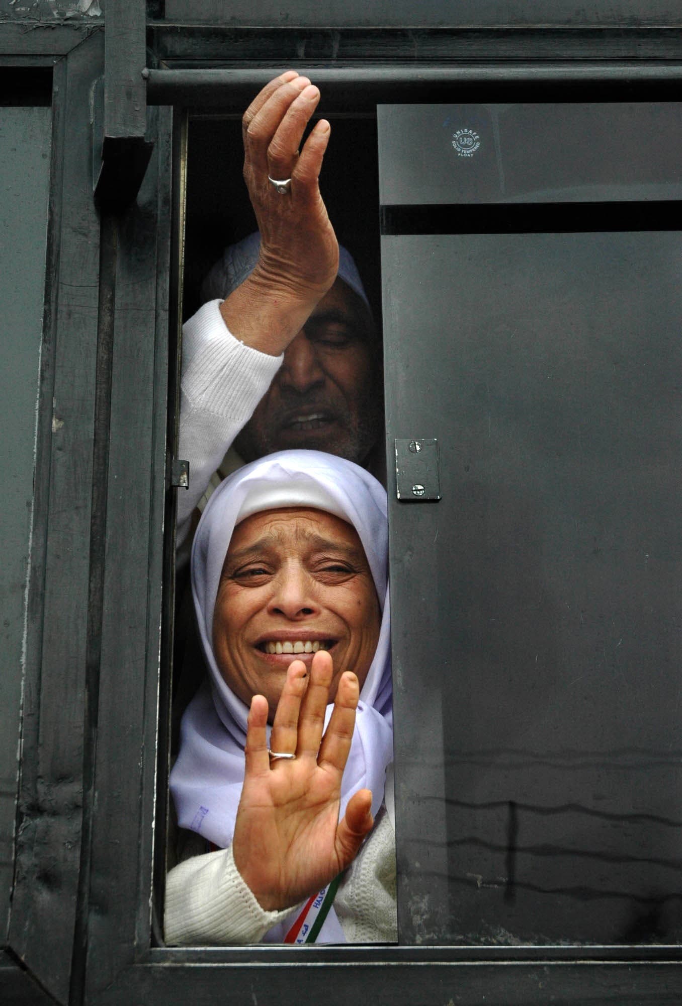 Kashmiri Muslim pilgrims wave as they leave for Hajj in Srinagar, India, on Dec. 3, 2005. (AP)