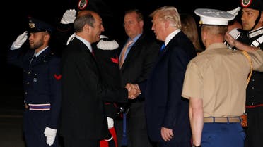 US President Donald Trump is greeted by Italy’s Chief of Protocol Riccardo Guariglia (left) as he arrives aboard Air Force One at Sigonella Air Force Base at Naval Air Station Sigonella in Sicily, Italy, on May 25, 2017. (Reuters)