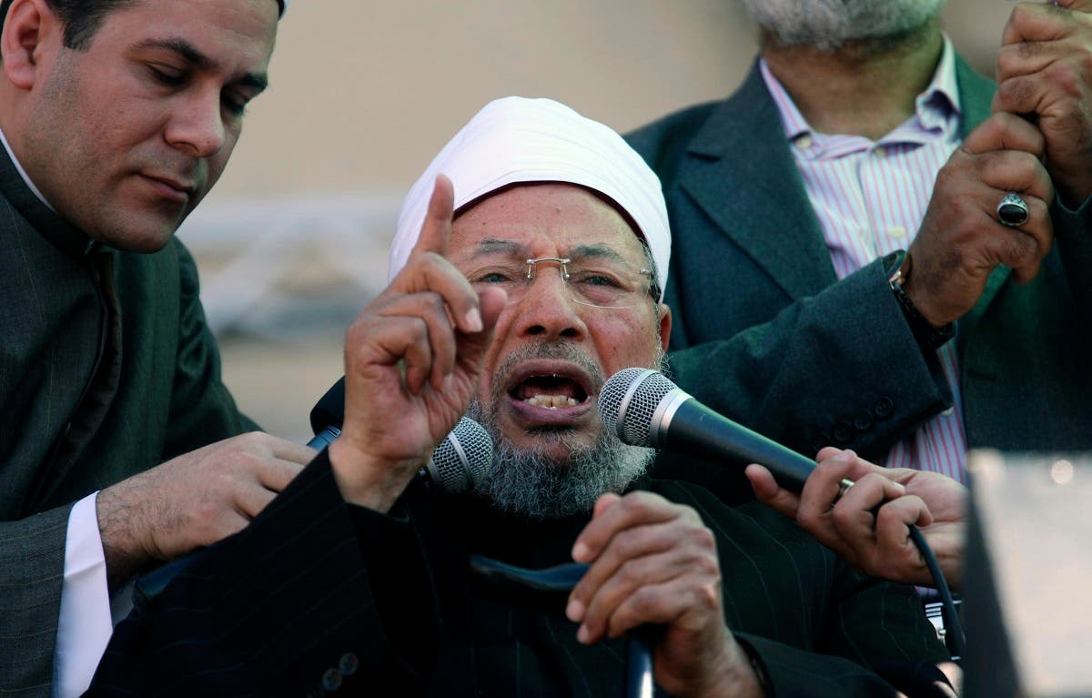 Egyptian cleric Sheik Youssef el-Qaradawi, who resides in Doha, speaks to the crowd as he leads Friday prayers in Tahrir Square in Cairo in 2011. (File photo: AP)