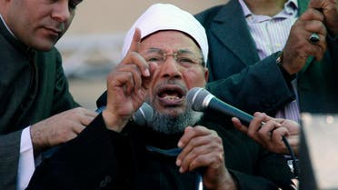 Egyptian cleric Sheik Youssef el-Qaradawi, who resides in Doha, speaks to the crowd as he leads Friday prayers in Tahrir Square in Cairo in 2011. (File photo: AP)