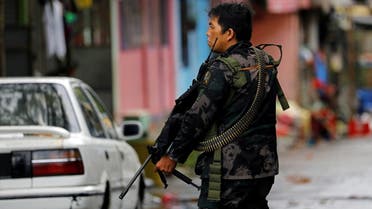 A government soldier takes up position during a patrol along a deserted street in Marawi City, southern Philippines, on May 27, 2017. (Reuters)