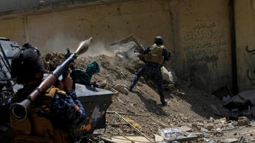 An Iraqi Federal Police member fires towards ISIS militants during a battle in western Mosul, on May 28, 2017. (Reuters)