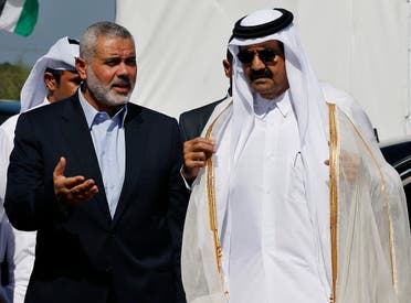 Hamas leader Ismail Haniyeh (L) and then Emir of Qatar Sheikh Hamad bin Khalifa al-Thani arrive at a cornerstone laying ceremony for a residential neighborhood in Gaza Strip on October 23, 2012. (Reuters)
