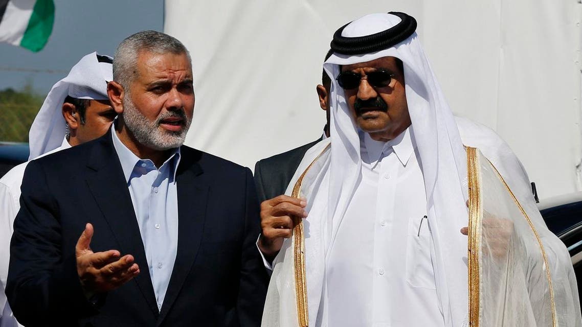 Hamas leader Ismail Haniyeh (L) and then Emir of Qatar Sheikh Hamad bin Khalifa al-Thani arrive at a cornerstone laying ceremony for a residential neighborhood in Gaza Strip on October 23, 2012. (Reuters)
