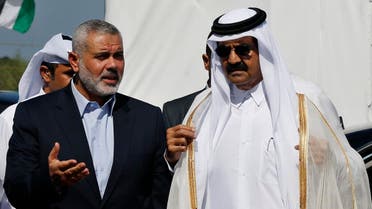 Hamas leader Ismail Haniyeh (L) and then Emir of Qatar Sheikh Hamad bin Khalifa al-Thani arrive at a cornerstone laying ceremony for a residential neighborhood in Gaza Strip on October 23, 2012. (Reuters)