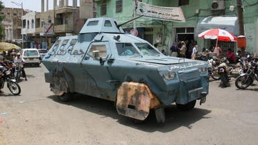 An armoured vehicle used by pro-government fighters drives on a street in the war-torn southwestern city of Taiz. (Reuters)