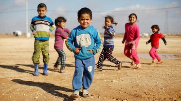 Syrian refugee children play at Al Zaatari refugee camp in Jordan near the border with Syria, December 3, 2016. (Reuters)
